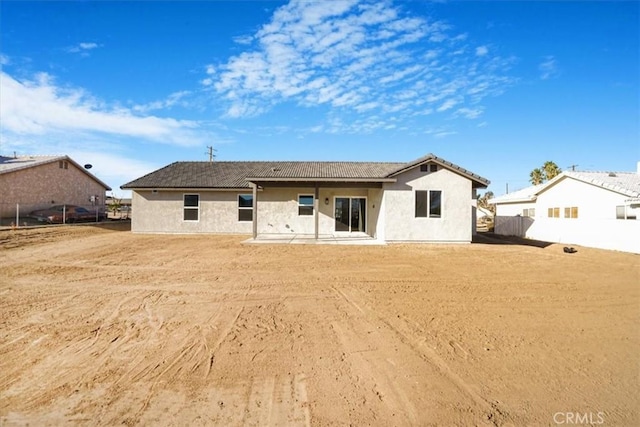 back of property featuring a patio area