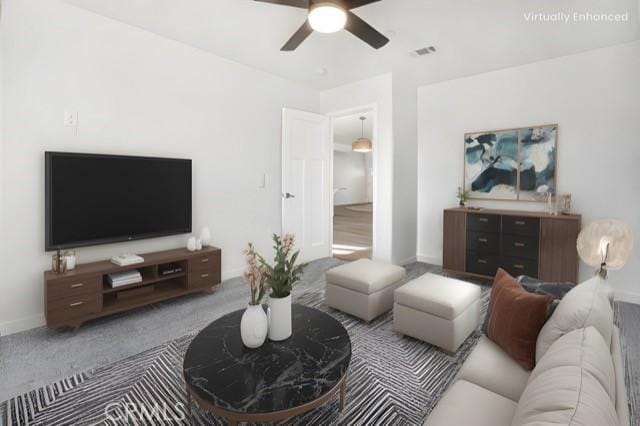 carpeted living room featuring ceiling fan