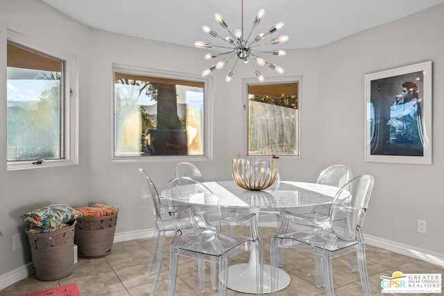 tiled dining space with an inviting chandelier