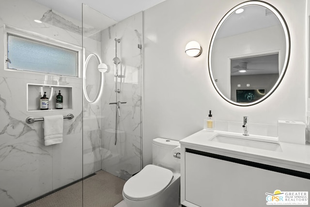 bathroom with vanity, toilet, and an enclosed shower