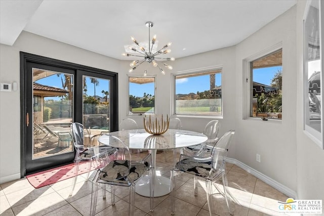 dining area featuring plenty of natural light, light tile patterned floors, and an inviting chandelier