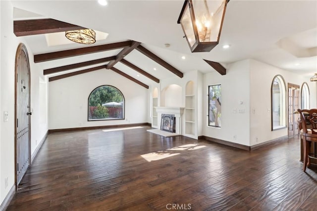 unfurnished living room with vaulted ceiling with beams and dark hardwood / wood-style floors