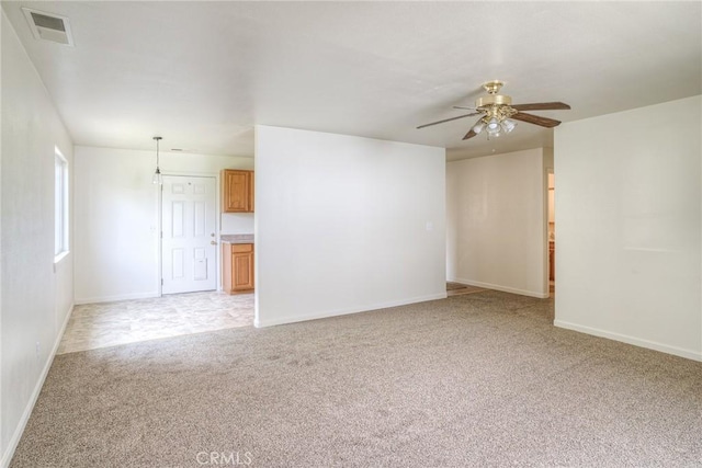 carpeted empty room with ceiling fan