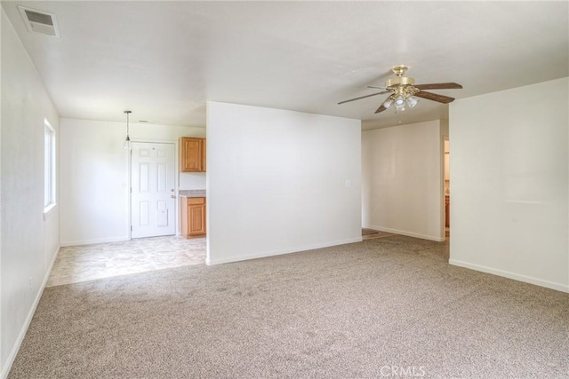 empty room with light carpet and ceiling fan