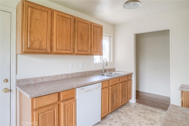 kitchen with white dishwasher and sink