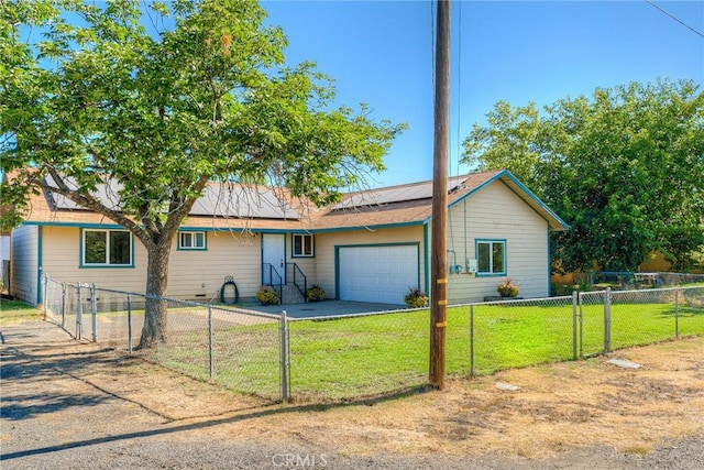 ranch-style house with a front lawn, a garage, and solar panels