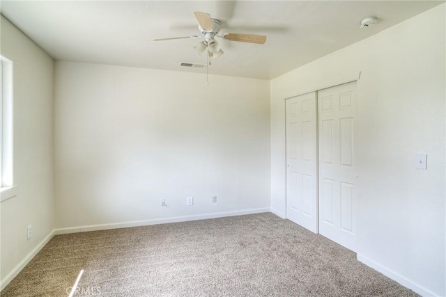 unfurnished bedroom with carpet flooring, ceiling fan, and a closet