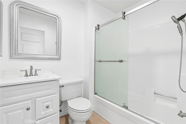 full bathroom featuring shower / bath combination with glass door, vanity, and toilet