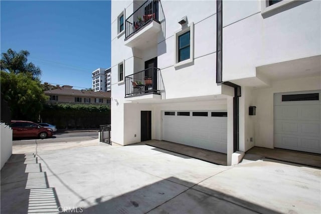 view of side of home with a garage