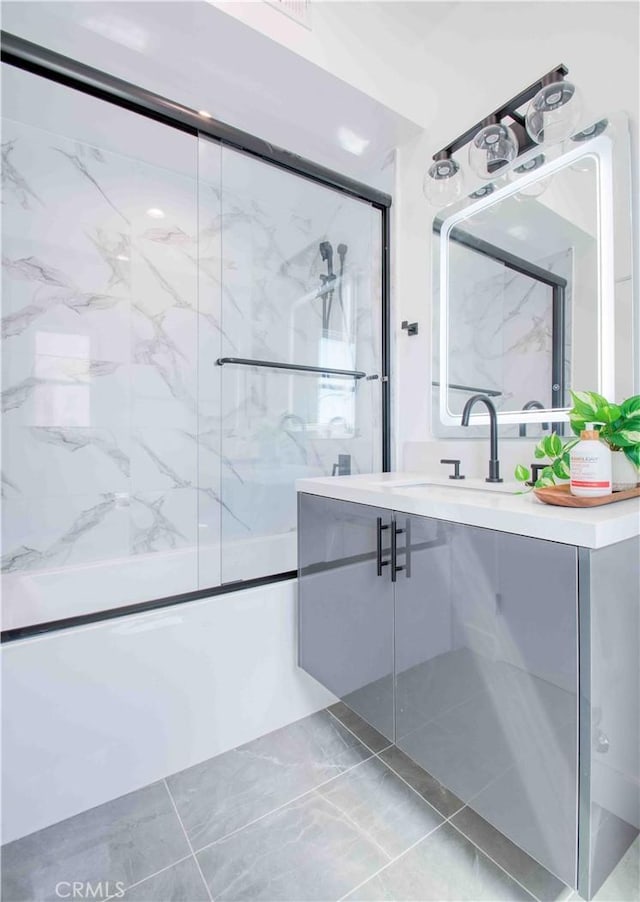 bathroom with vanity and enclosed tub / shower combo