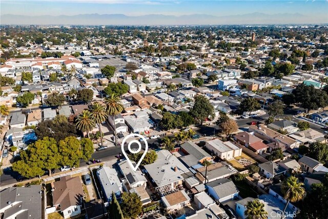 birds eye view of property with a mountain view