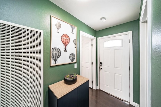 foyer with dark hardwood / wood-style flooring