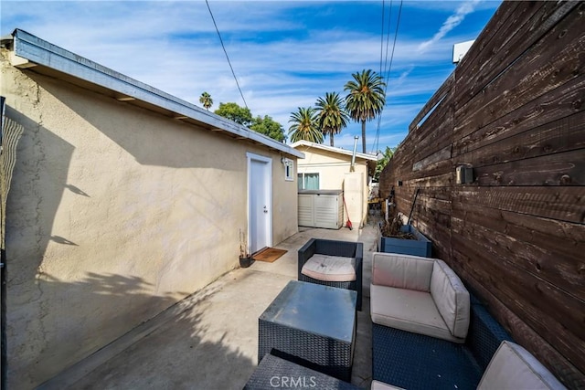 view of patio / terrace featuring fence and an outdoor living space