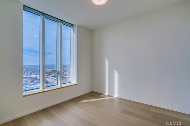 spare room featuring light hardwood / wood-style floors