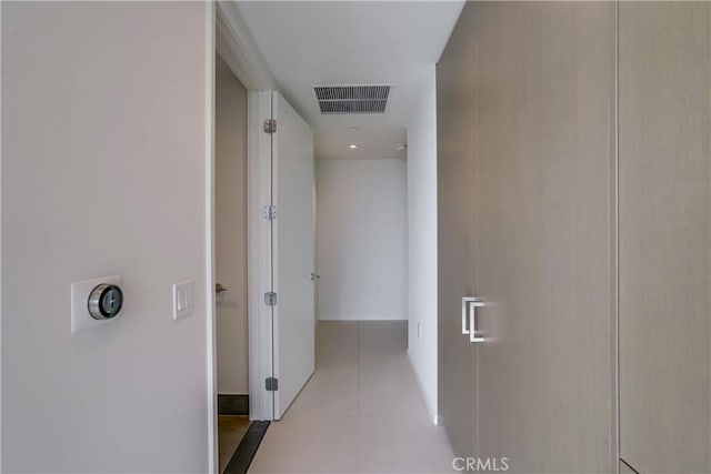 hallway featuring light tile patterned floors