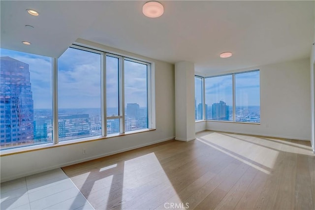 spare room featuring light hardwood / wood-style floors