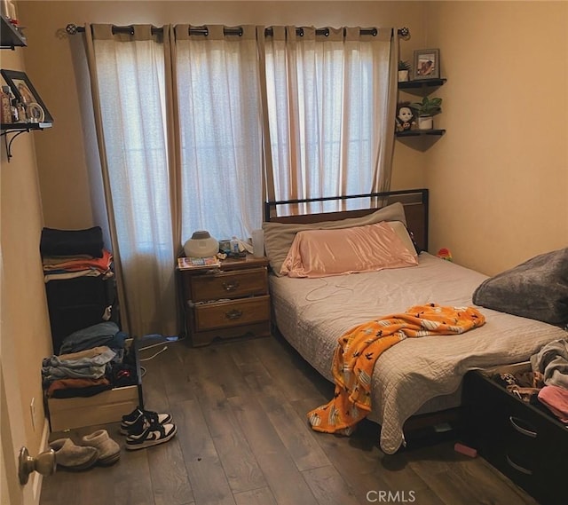 bedroom featuring dark hardwood / wood-style floors