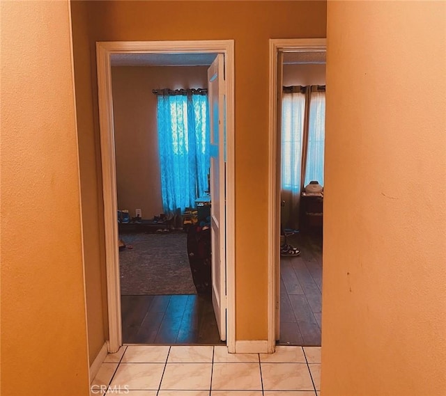 corridor with light hardwood / wood-style flooring