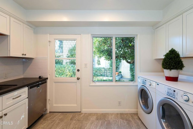 laundry area featuring cabinets and separate washer and dryer