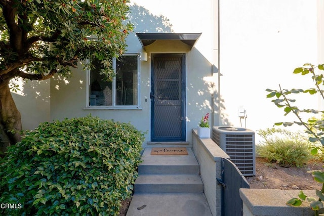 entrance to property featuring central AC