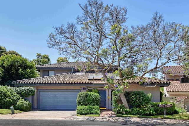 mediterranean / spanish-style house featuring a garage