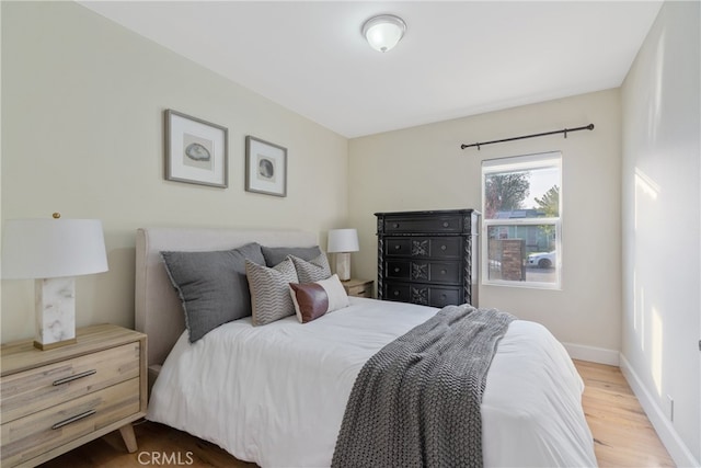 bedroom with wood-type flooring