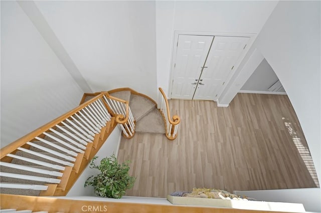 staircase featuring hardwood / wood-style flooring