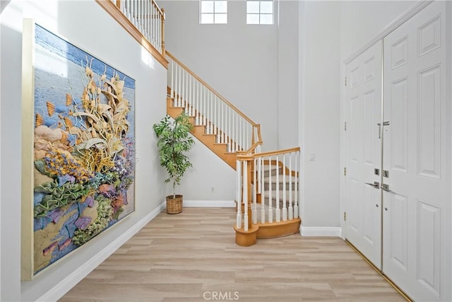 foyer entrance with light hardwood / wood-style flooring