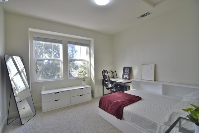 bedroom featuring light carpet