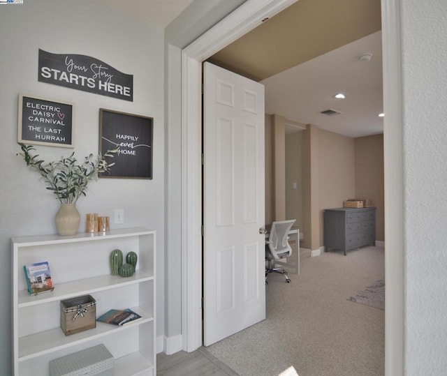 hallway featuring carpet floors