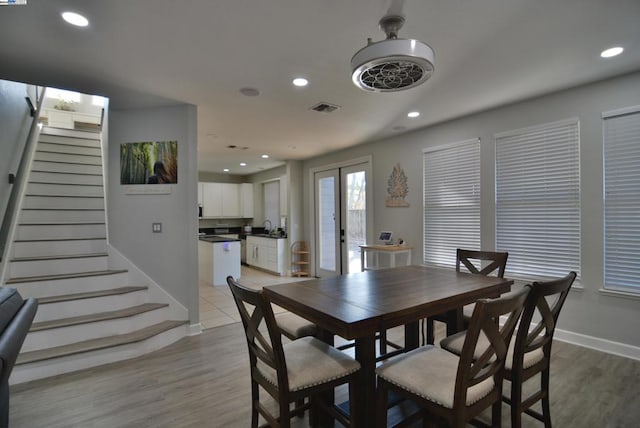 dining space with light hardwood / wood-style flooring