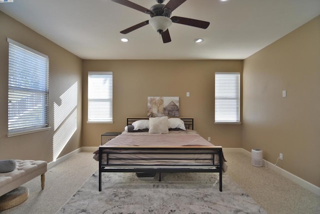 carpeted bedroom featuring ceiling fan