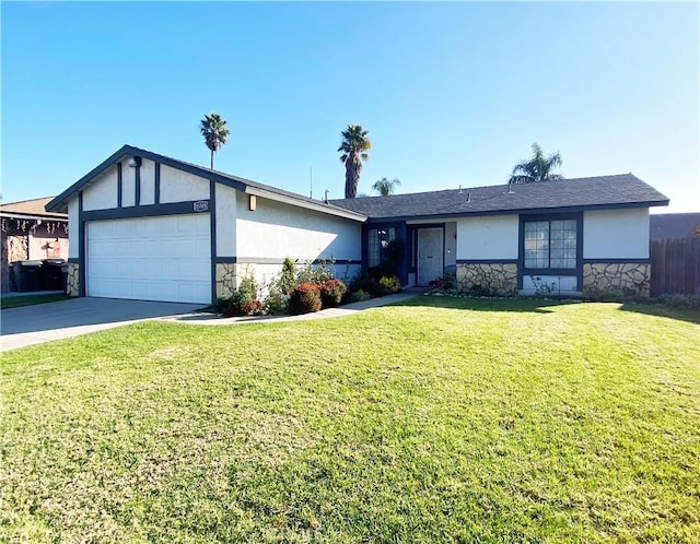 single story home with a garage and a front lawn