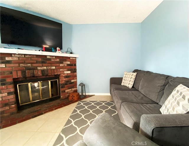 tiled living room featuring a textured ceiling and a fireplace