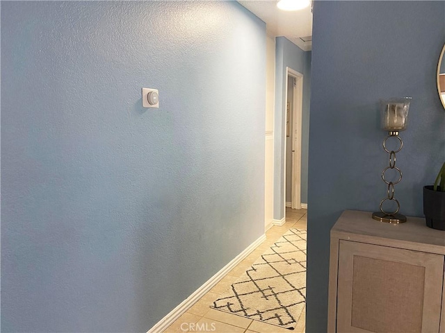 corridor with light tile patterned floors