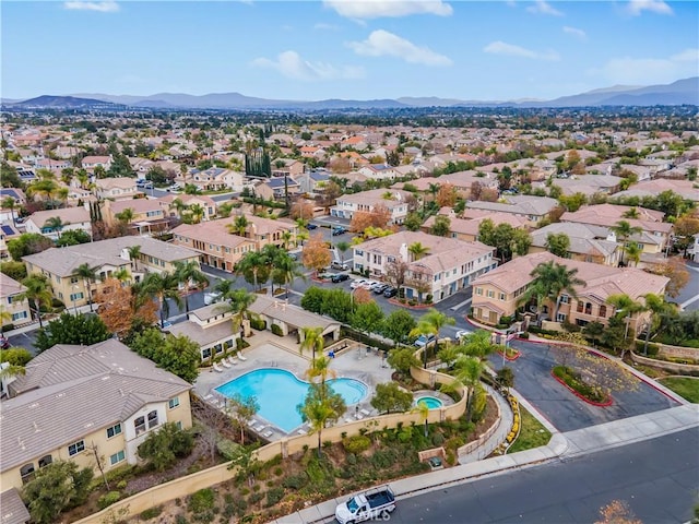 birds eye view of property with a mountain view