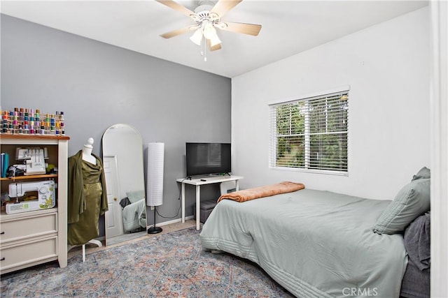 bedroom featuring ceiling fan and light colored carpet