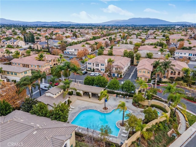 birds eye view of property with a mountain view