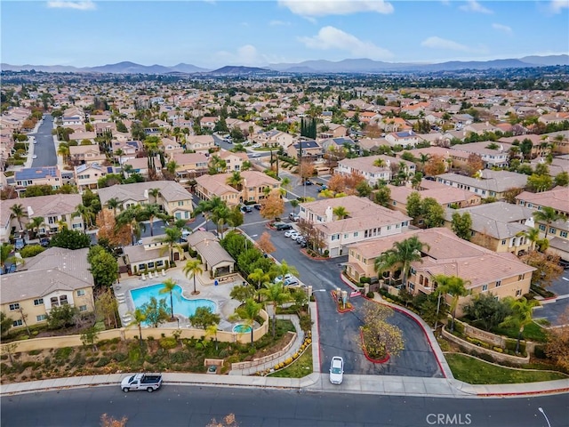 birds eye view of property with a mountain view