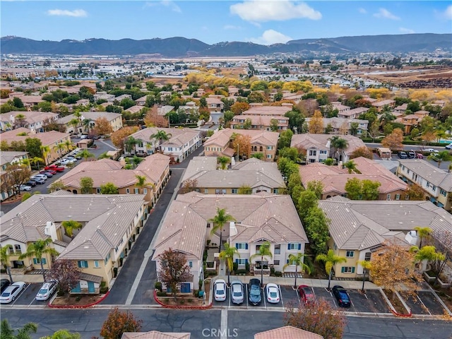 birds eye view of property featuring a mountain view