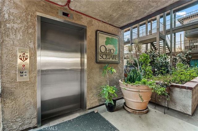 interior space with concrete floors and elevator