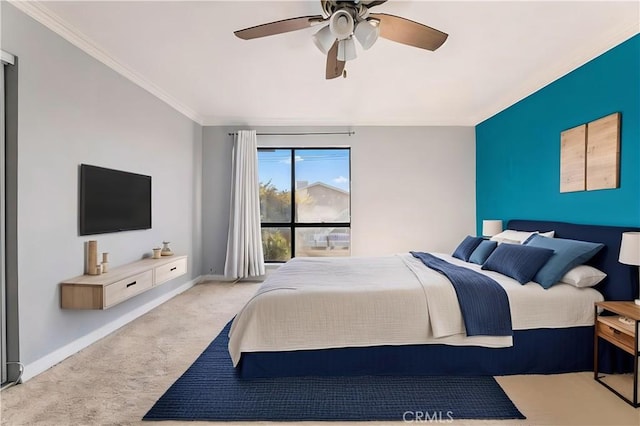 carpeted bedroom featuring ceiling fan and ornamental molding