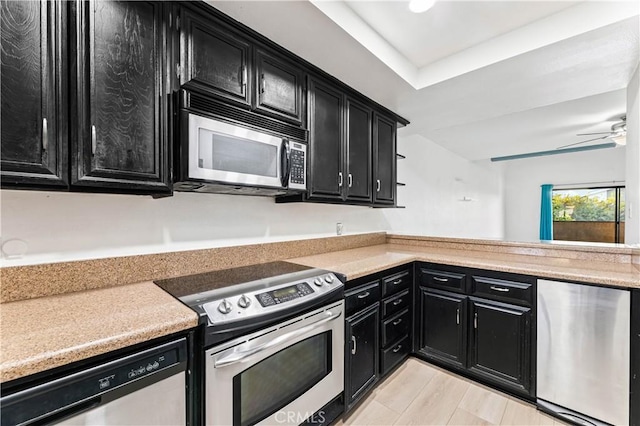 kitchen with ceiling fan, light hardwood / wood-style flooring, and stainless steel appliances