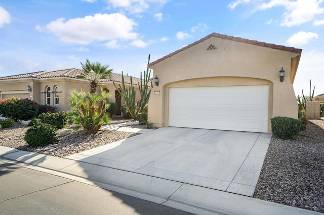 mediterranean / spanish-style home featuring a garage