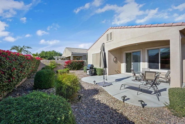 rear view of house featuring a patio area