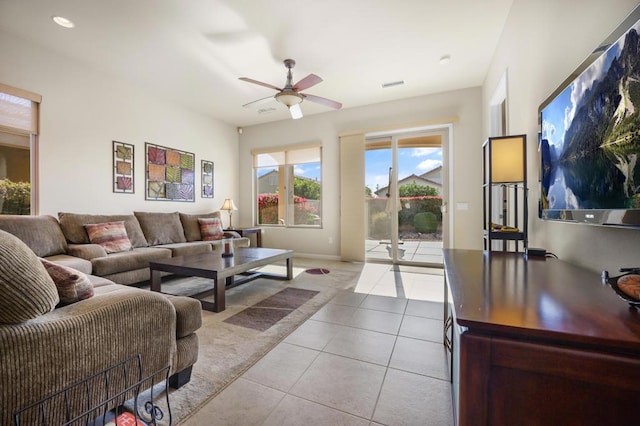 living room featuring ceiling fan and light tile patterned flooring