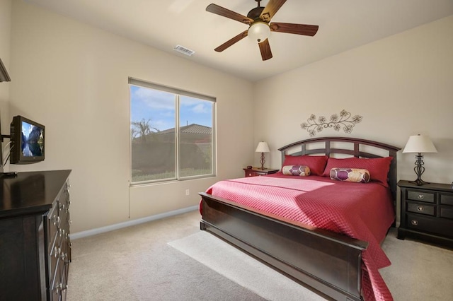 bedroom featuring ceiling fan and light carpet