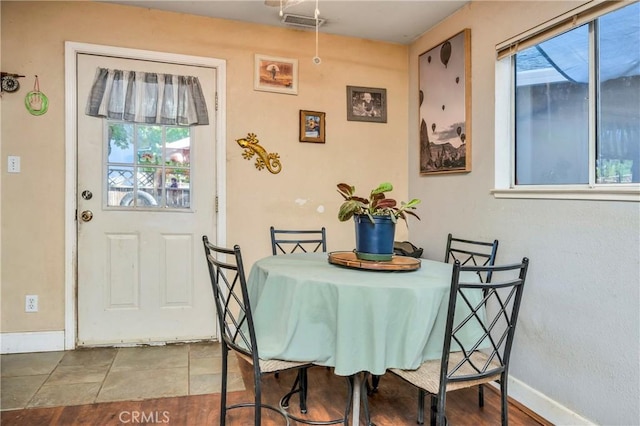 dining space featuring plenty of natural light