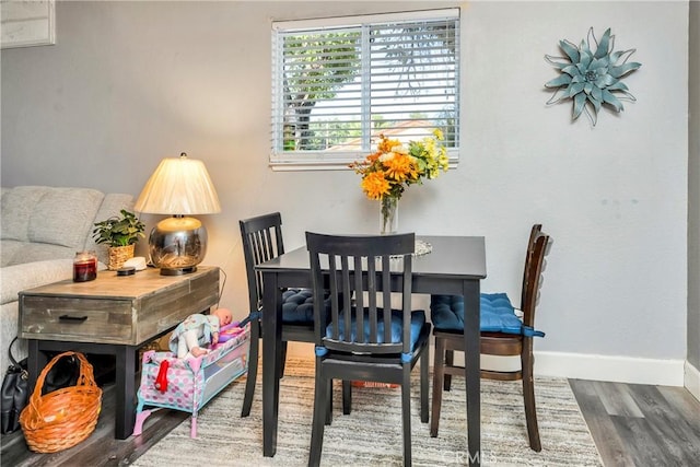 dining room with hardwood / wood-style flooring