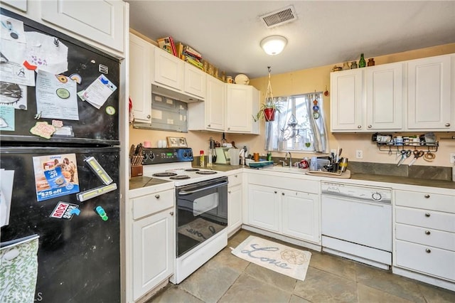 kitchen with white cabinets, white appliances, and sink